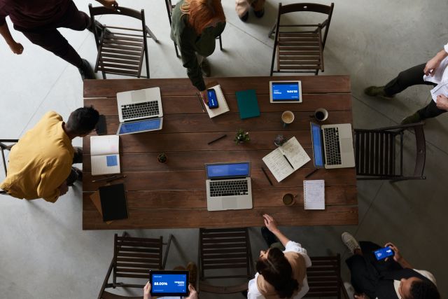 Photo Of Laptops On Top Of Wooden Table