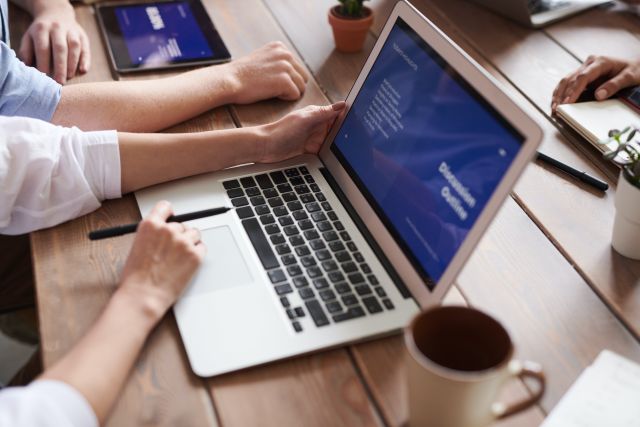 Photo Of Person Holding Laptop